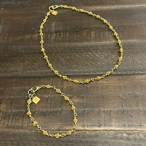 Woman’s gold necklace and bracelet